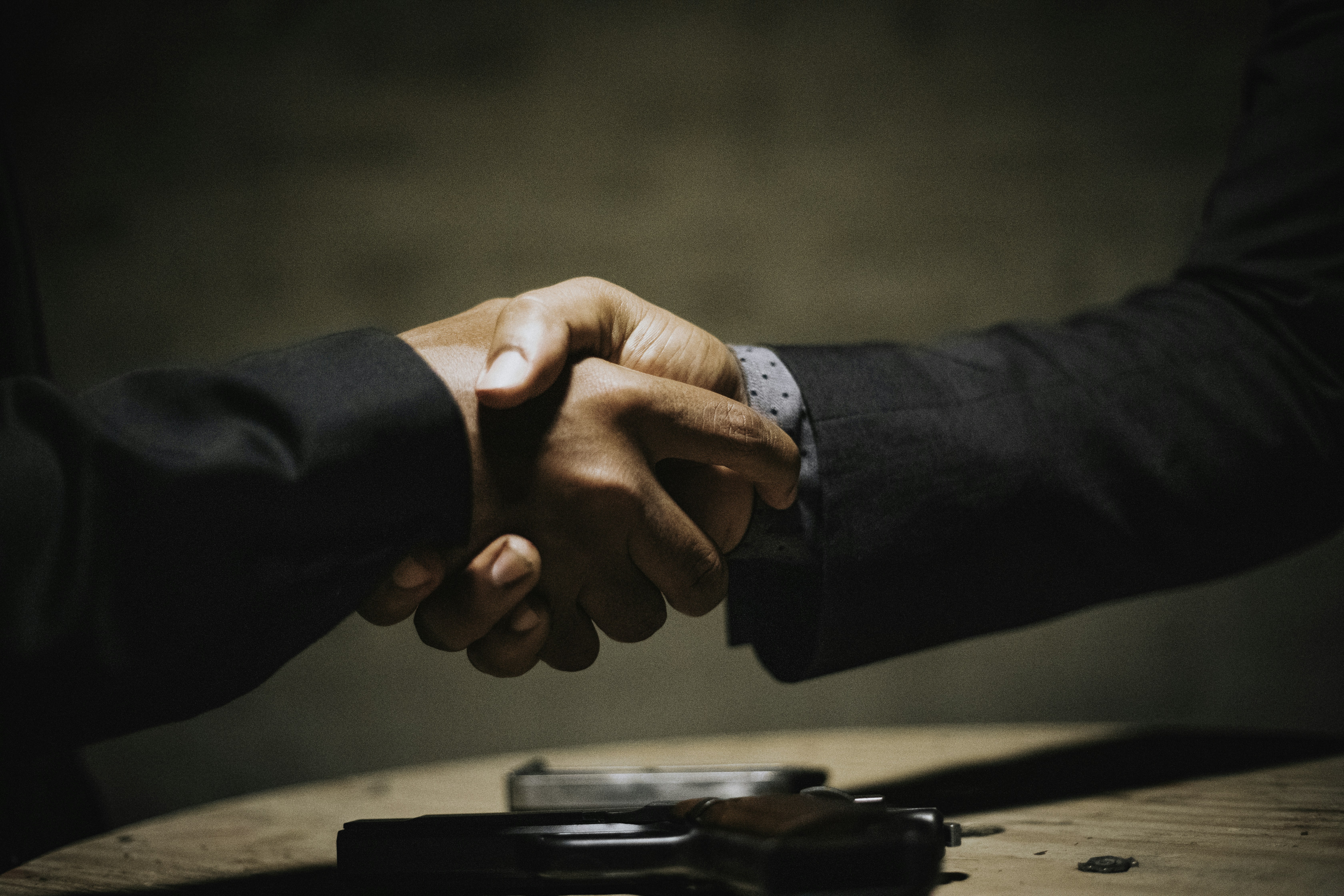Insurance agent handshake with client, trust and welcome