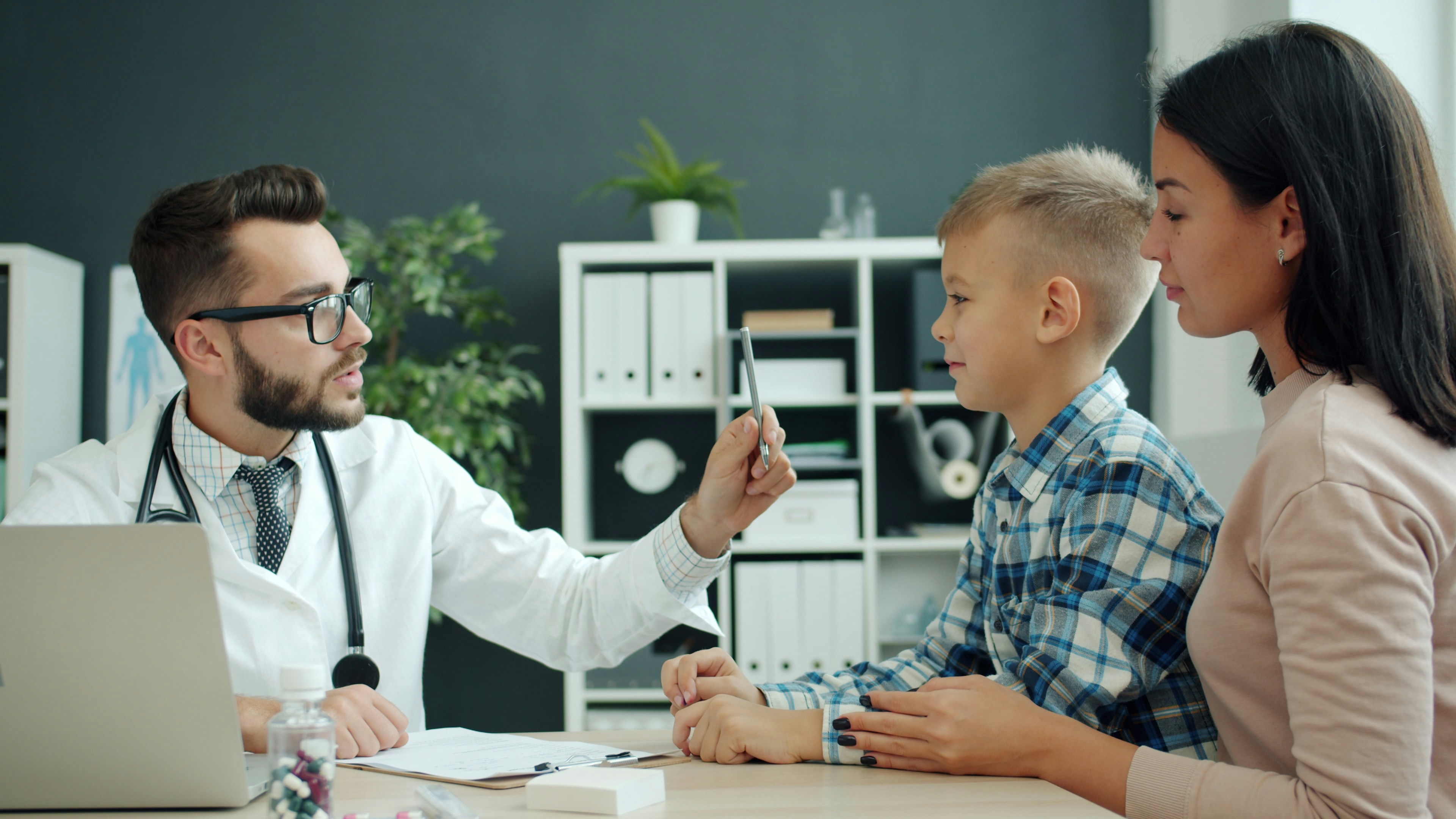 Parents and child at home, life insurance